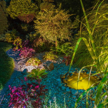 Backyard Garden After Dark. Rockery Garden Lighting.